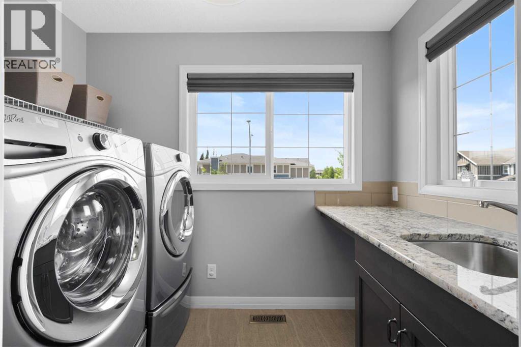 103 Masters Rise Se, Calgary, AB - Indoor Photo Showing Laundry Room