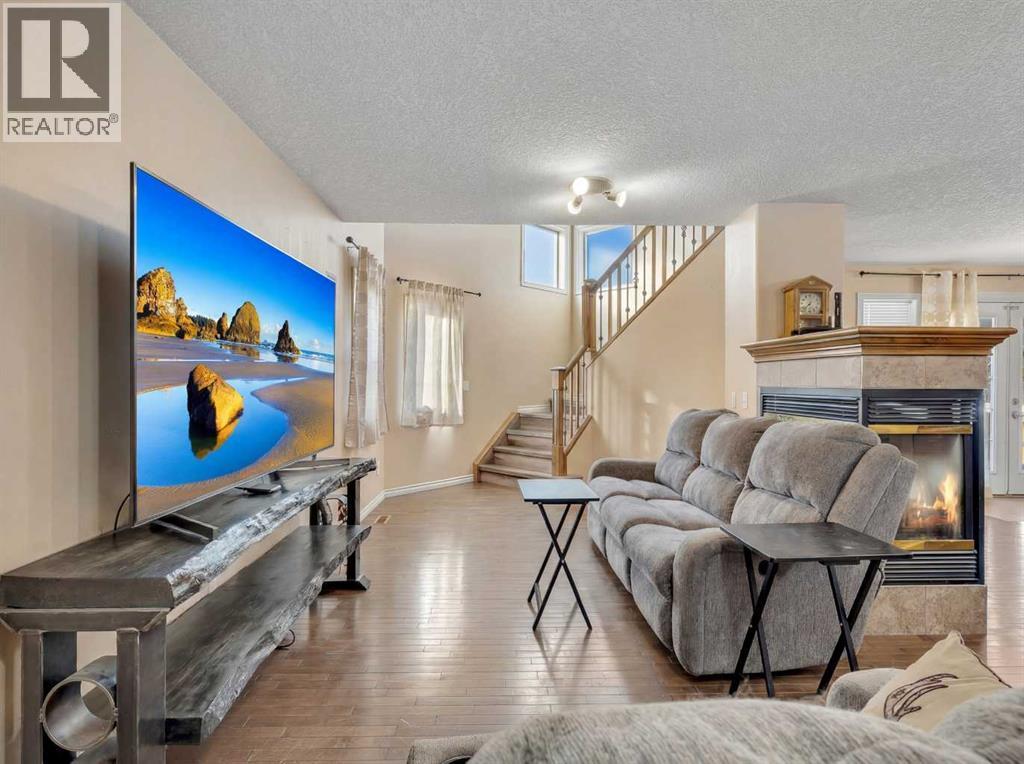 Living - 60 Sherwood Way Nw, Calgary, AB - Indoor Photo Showing Living Room With Fireplace