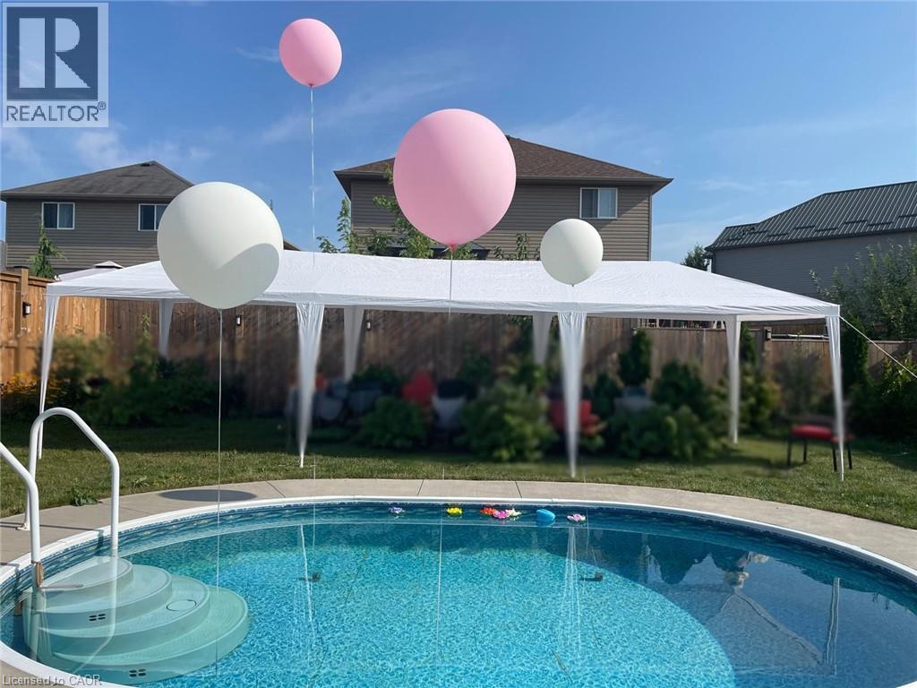 32 Hudson Drive, Cayuga, ON - Outdoor With Above Ground Pool With Backyard