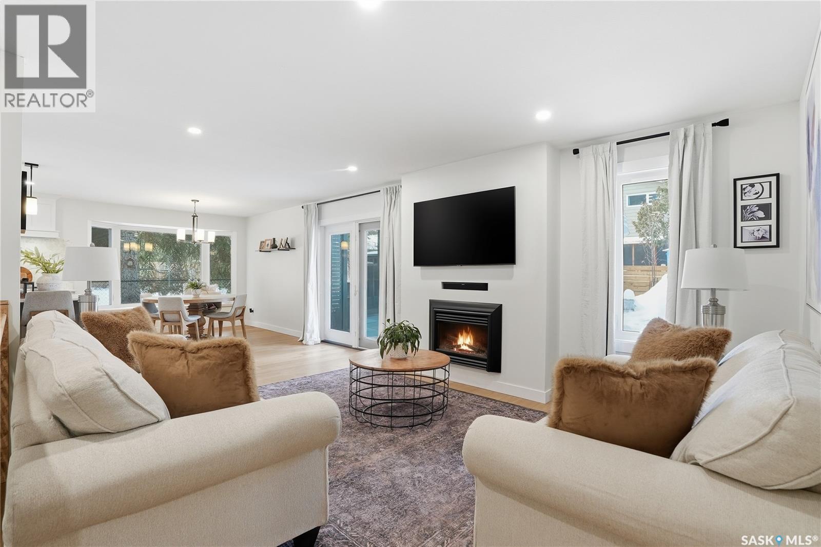 115 Whiteswan Drive, Saskatoon, SK - Indoor Photo Showing Living Room With Fireplace