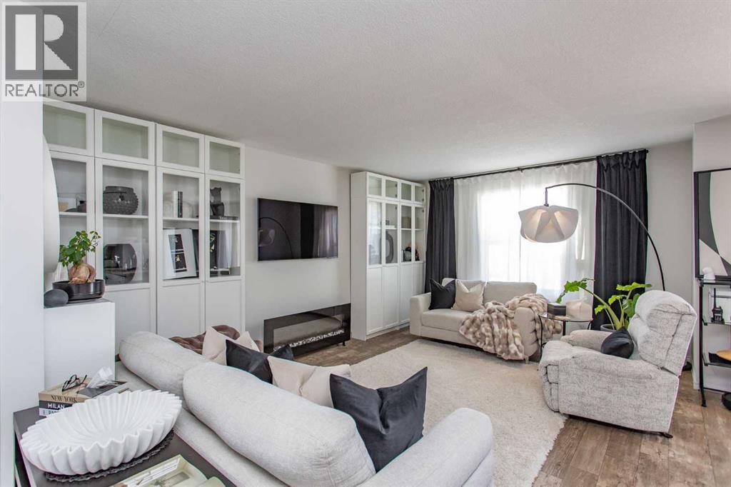 4, 20 Jacobs Close, Red Deer, AB - Indoor Photo Showing Living Room With Fireplace
