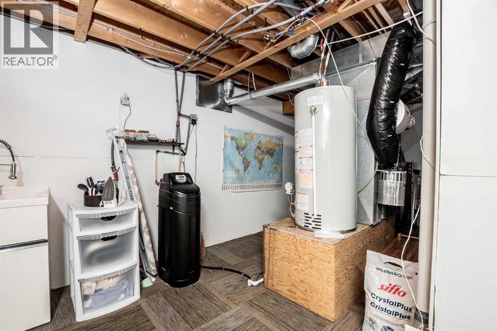 Utility Room - 509 Highview Point Nw, High River, AB - Indoor Photo Showing Basement