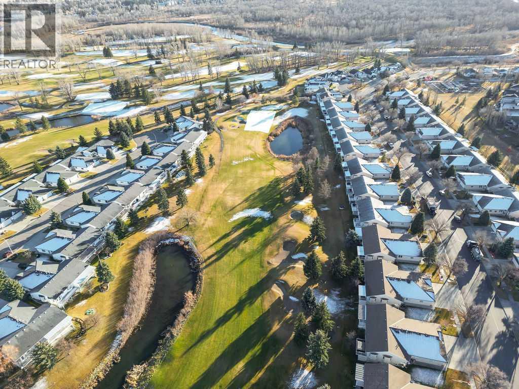 Backing on to Hole #16 - 509 Highview Point Nw, High River, AB - Outdoor With View