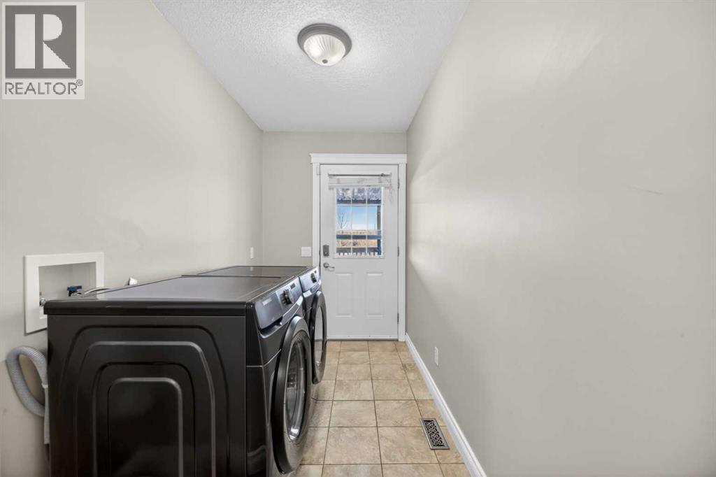 31 Valarosa Drive, Didsbury, AB - Indoor Photo Showing Laundry Room
