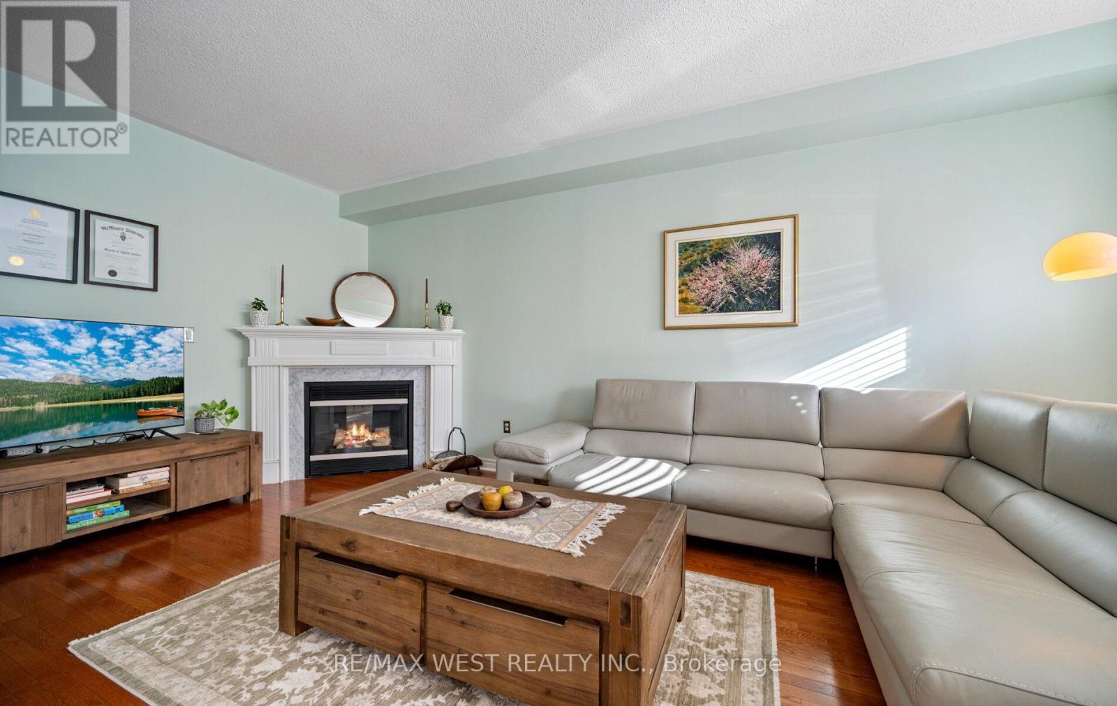 Family Room - 3374 Artesian Drive, Mississauga, ON - Indoor Photo Showing Living Room With Fireplace