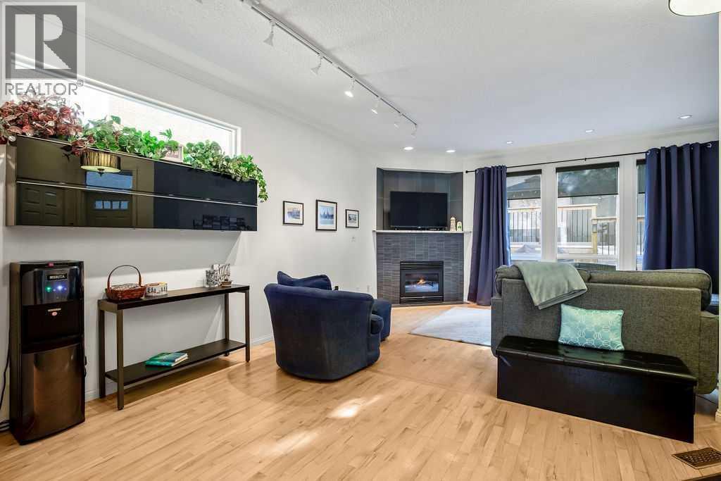 47 28 Avenue Sw, Calgary, AB - Indoor Photo Showing Other Room With Fireplace