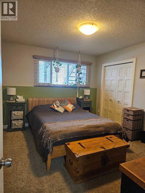 Primary Bedroom - 2, 630 3Rd Street, Canmore, AB - Indoor Photo Showing Bedroom