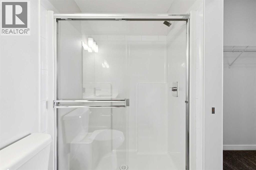 208, 30 Shawnee Common Sw, Calgary, AB - Indoor Photo Showing Bathroom