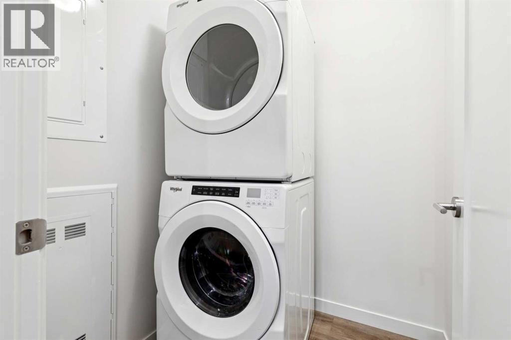 208, 30 Shawnee Common Sw, Calgary, AB - Indoor Photo Showing Laundry Room