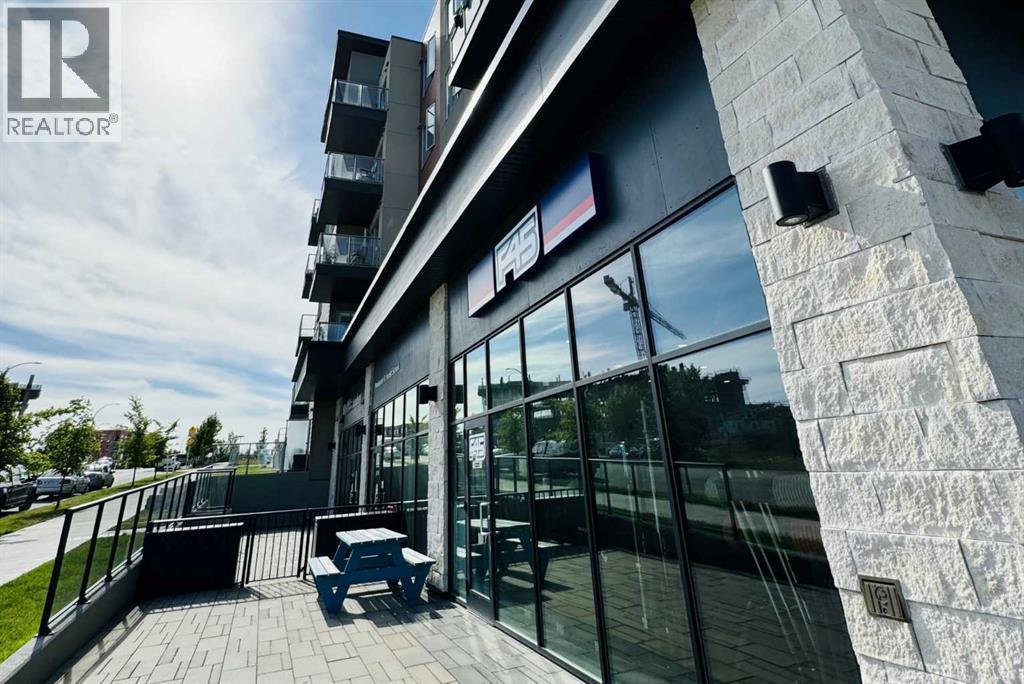 208, 30 Shawnee Common Sw, Calgary, AB - Outdoor With Exterior