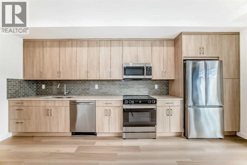 7320, 1802 Mahogany Boulevard Se, Calgary, AB - Indoor Photo Showing Kitchen With Stainless Steel Kitchen