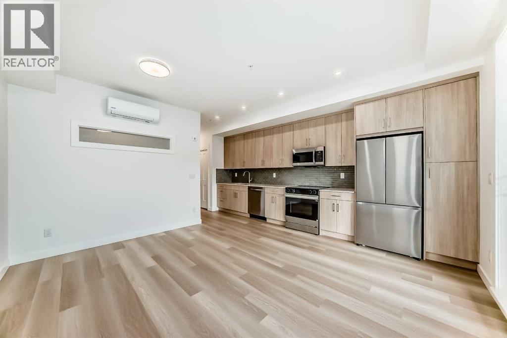 7320, 1802 Mahogany Boulevard Se, Calgary, AB - Indoor Photo Showing Kitchen With Stainless Steel Kitchen