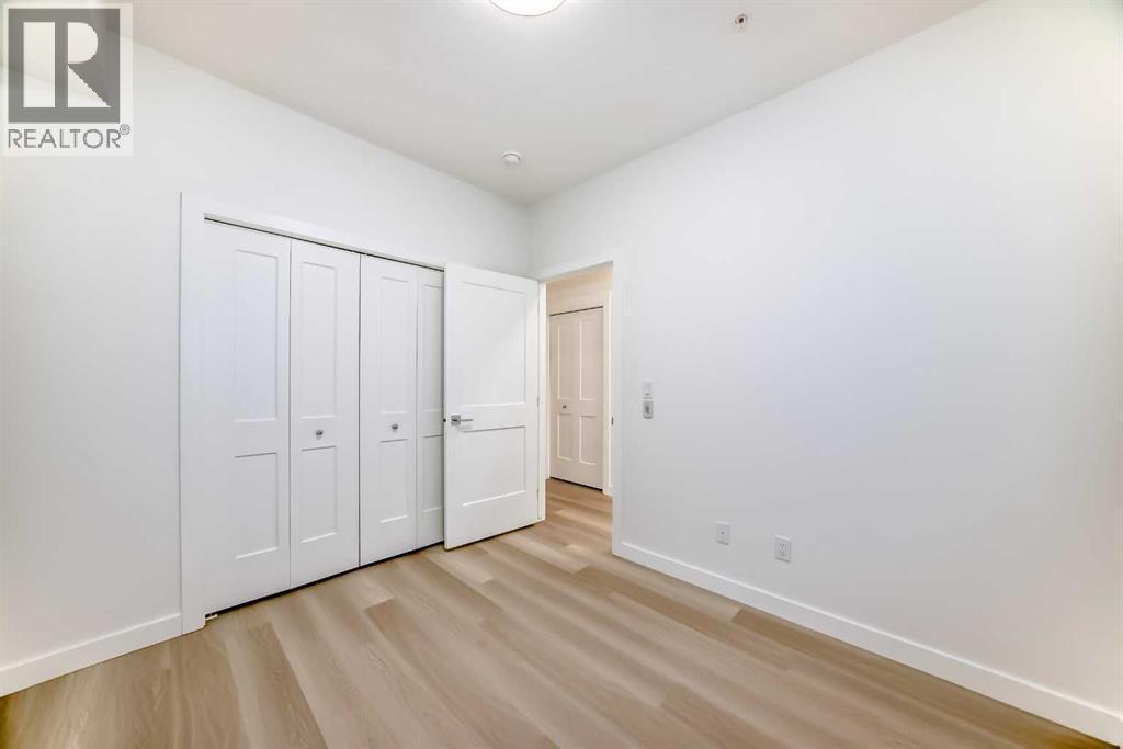 7320, 1802 Mahogany Boulevard Se, Calgary, AB - Indoor Photo Showing Other Room
