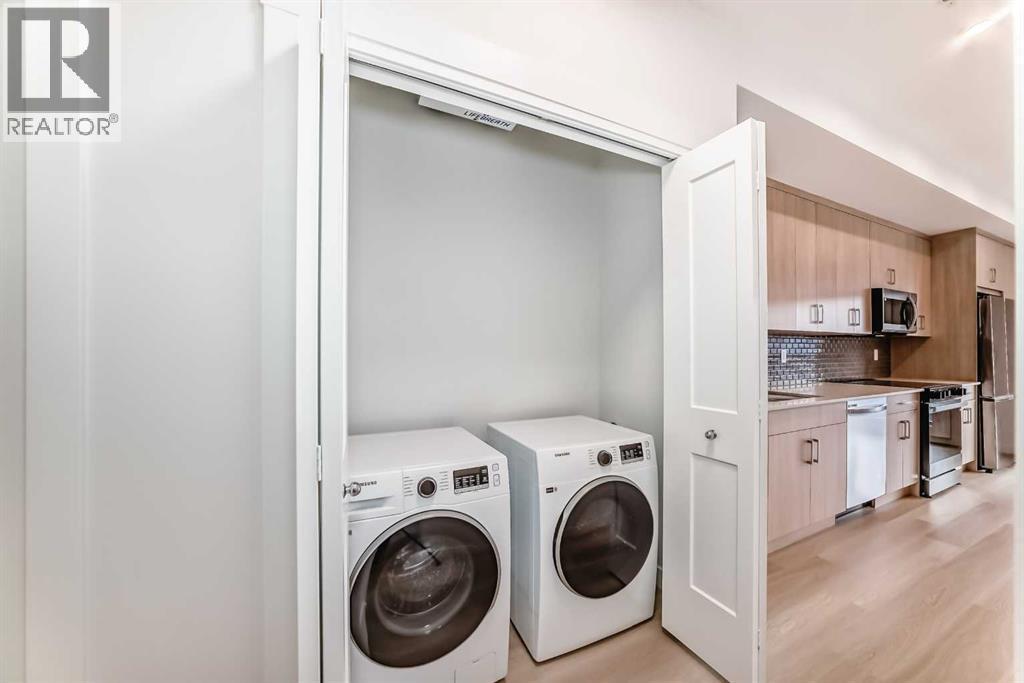 7320, 1802 Mahogany Boulevard Se, Calgary, AB - Indoor Photo Showing Laundry Room