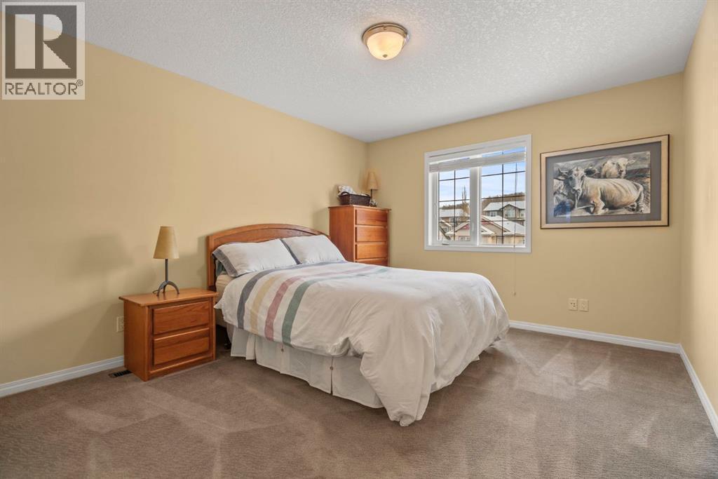 153 Crestridge Way Sw, Calgary, AB - Indoor Photo Showing Bedroom