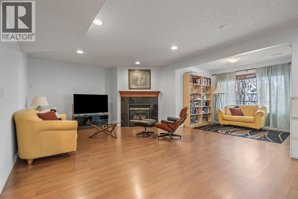 153 Crestridge Way Sw, Calgary, AB - Indoor With Fireplace