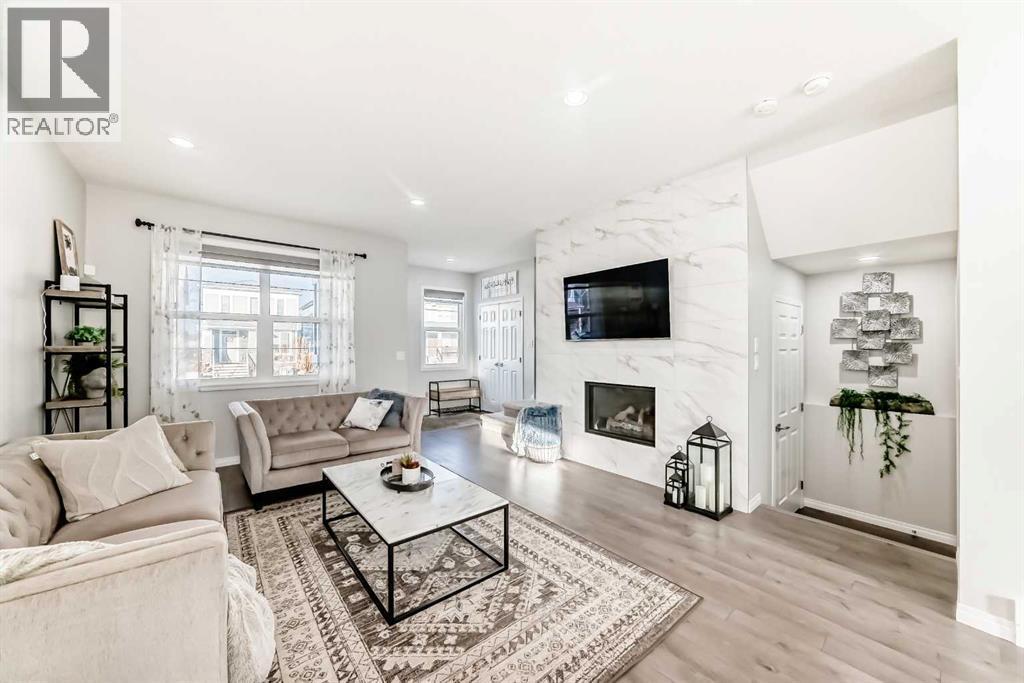 159 Evanscrest Park Nw, Calgary, AB - Indoor Photo Showing Living Room With Fireplace