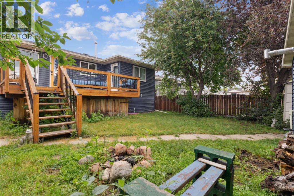 Backyard - 147 Falchurch Crescent Ne, Calgary, AB - Outdoor With Deck Patio Veranda
