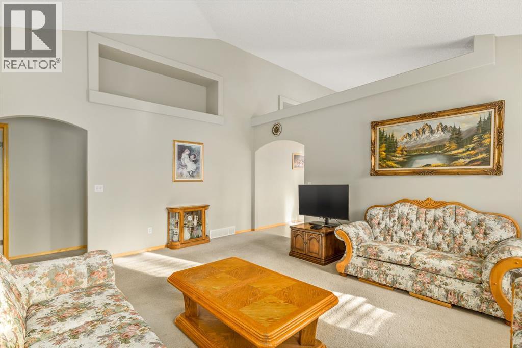 131 Panatella Close Nw, Calgary, AB - Indoor Photo Showing Living Room