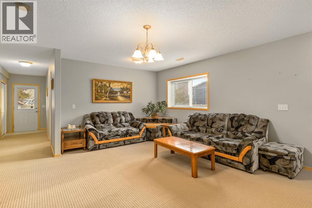 131 Panatella Close Nw, Calgary, AB - Indoor Photo Showing Living Room