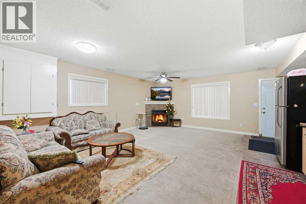 81 Saddlemont Road Ne, Calgary, AB - Indoor Photo Showing Living Room With Fireplace