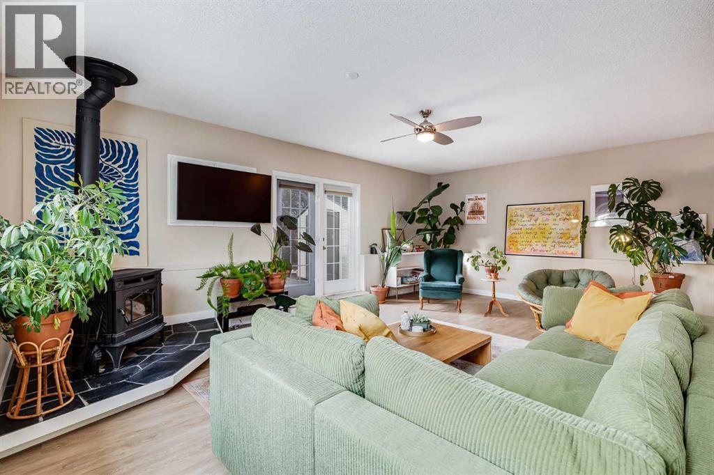 4351 70 Street Nw, Calgary, AB - Indoor Photo Showing Living Room With Fireplace