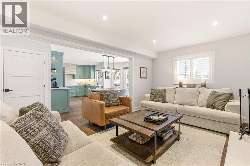 Living area with dark wood finished floors and recessed lighting - 697 Lambshead Drive, Burlington, ON - Indoor Photo Showing Living Room