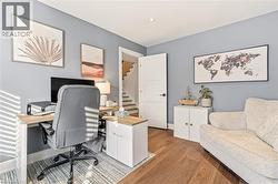 Office area featuring light wood-style flooring and baseboards -