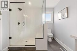 Bathroom with a shower stall and vanity -