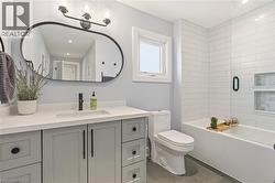 Full bath with vanity, combined bath / shower with glass door, and recessed lighting -