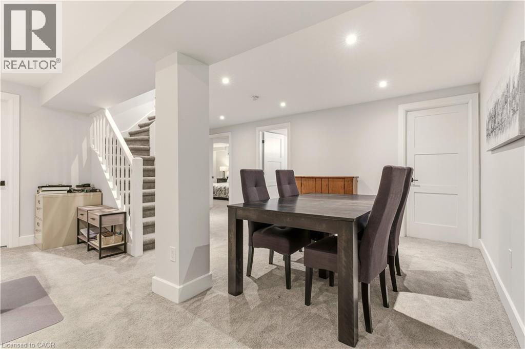 Dining space with stairway, light carpet, and recessed lighting - 697 Lambshead Drive, Burlington, ON - Indoor