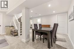 Dining space with stairway, light carpet, and recessed lighting -
