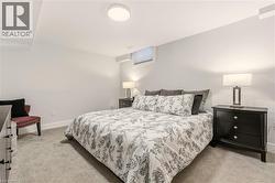 Bedroom featuring light colored carpet -