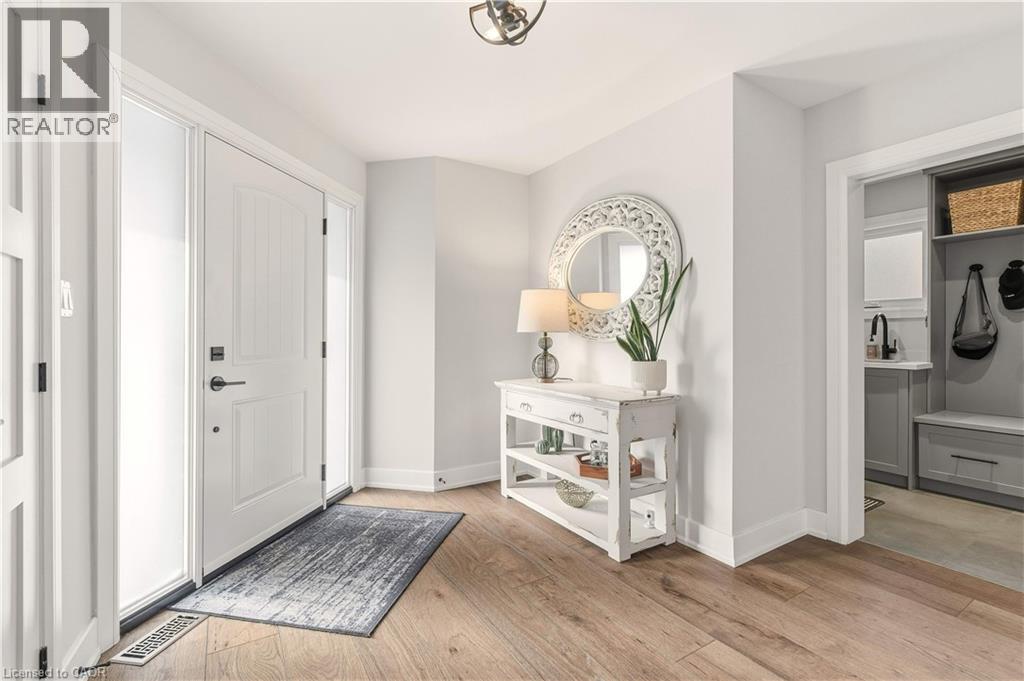 Foyer with light wood-style flooring and baseboards - 697 Lambshead Drive, Burlington, ON - Indoor Photo Showing Other Room