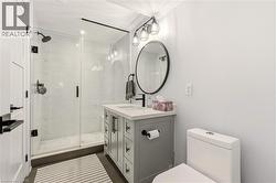 Full bath featuring vanity and a stall shower -