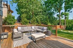 Wooden terrace featuring an outdoor living space -