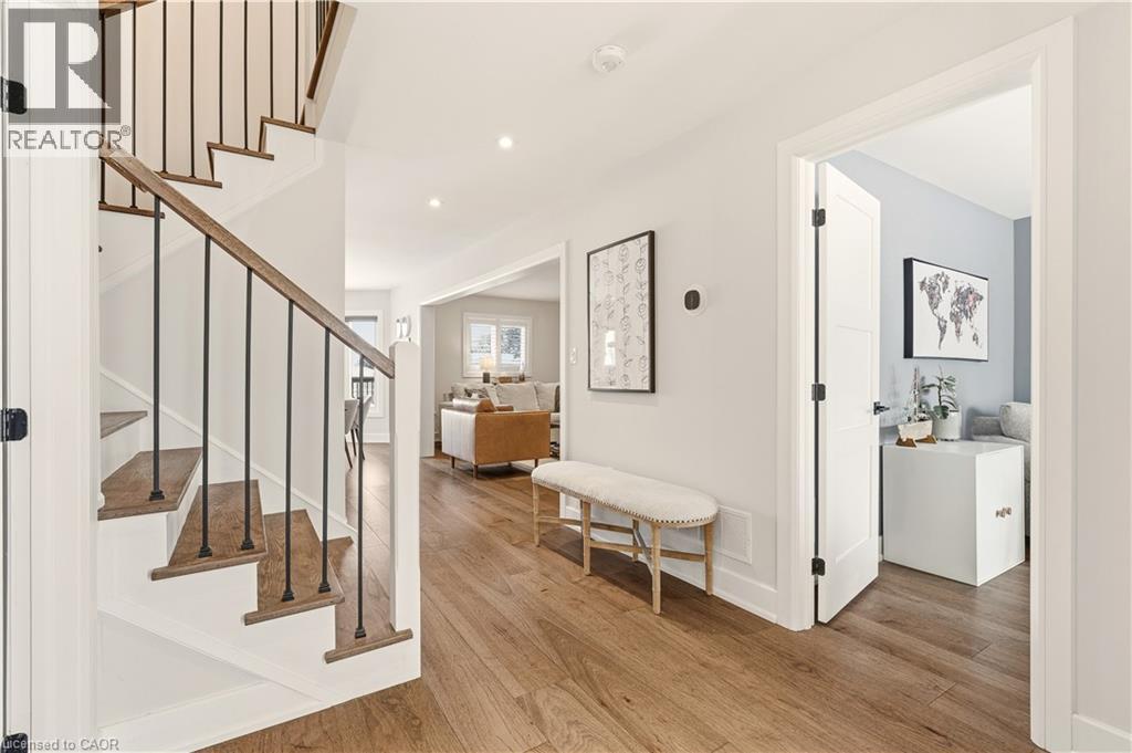 Foyer entrance with stairway, light wood-type flooring, and recessed lighting - 697 Lambshead Drive, Burlington, ON - Indoor Photo Showing Other Room