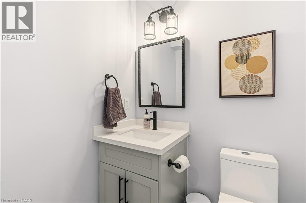 Half bathroom featuring vanity and toilet - 697 Lambshead Drive, Burlington, ON - Indoor Photo Showing Bathroom