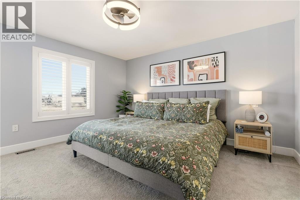 Bedroom featuring baseboards and light colored carpet - 697 Lambshead Drive, Burlington, ON - Indoor Photo Showing Bedroom