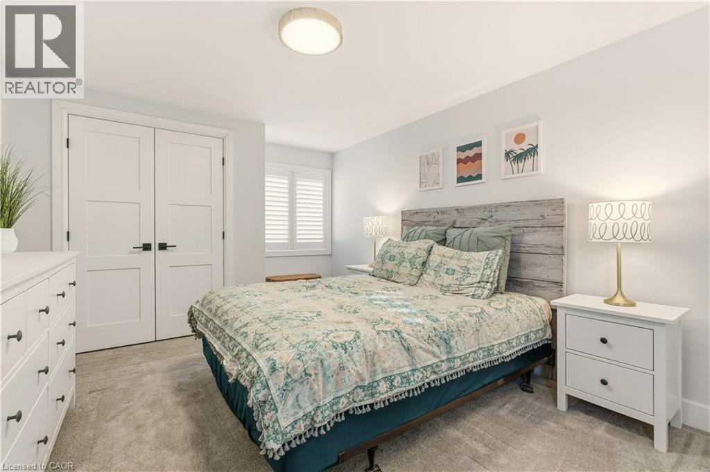 Bedroom featuring a closet and light carpet - 697 Lambshead Drive, Burlington, ON - Indoor Photo Showing Bedroom