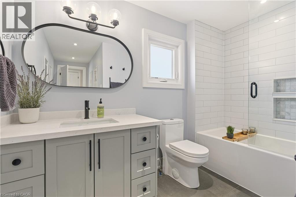 Full bath with vanity, combined bath / shower with glass door, and recessed lighting - 697 Lambshead Drive, Burlington, ON - Indoor Photo Showing Bathroom