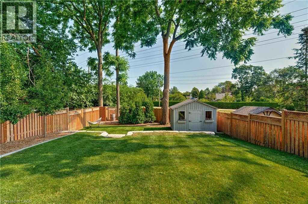 Fenced backyard with a shed - 697 Lambshead Drive, Burlington, ON - Outdoor