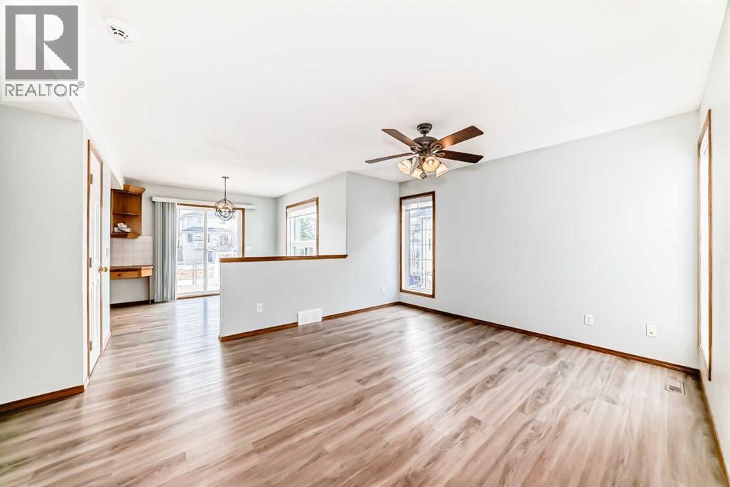 Newer flooring flows throughout the main level - 21 Hillview Road, Strathmore, AB - Indoor Photo Showing Other Room