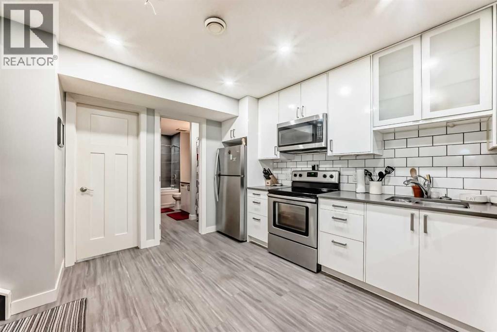 366 Auburn Bay Avenue Se, Calgary, AB - Indoor Photo Showing Kitchen With Double Sink