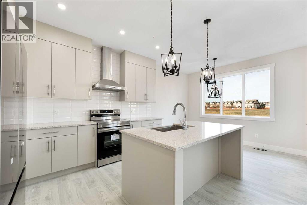 542 Ranch Green, Strathmore, AB - Indoor Photo Showing Kitchen With Upgraded Kitchen