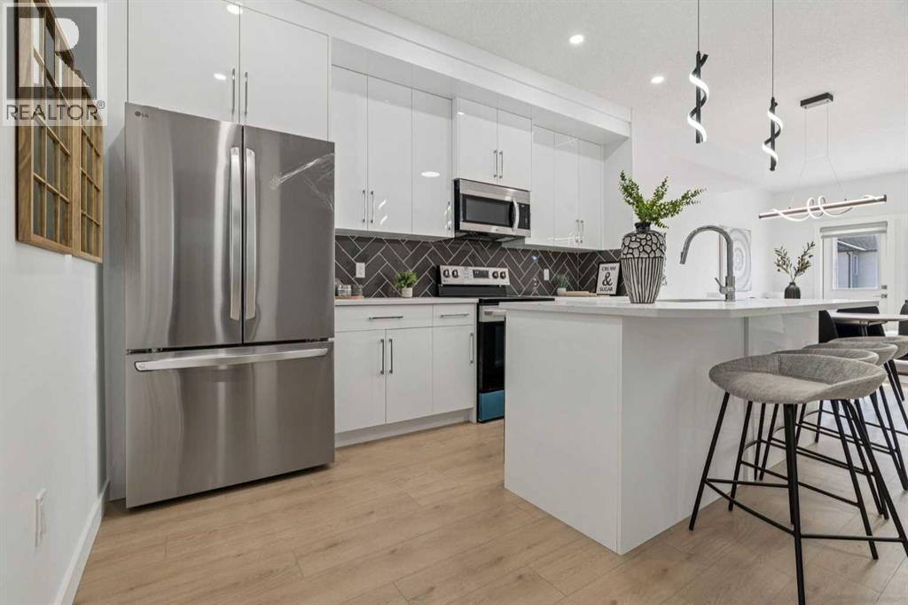 205, 95 Saddlecrest Circle Ne, Calgary, AB - Indoor Photo Showing Kitchen With Stainless Steel Kitchen With Upgraded Kitchen