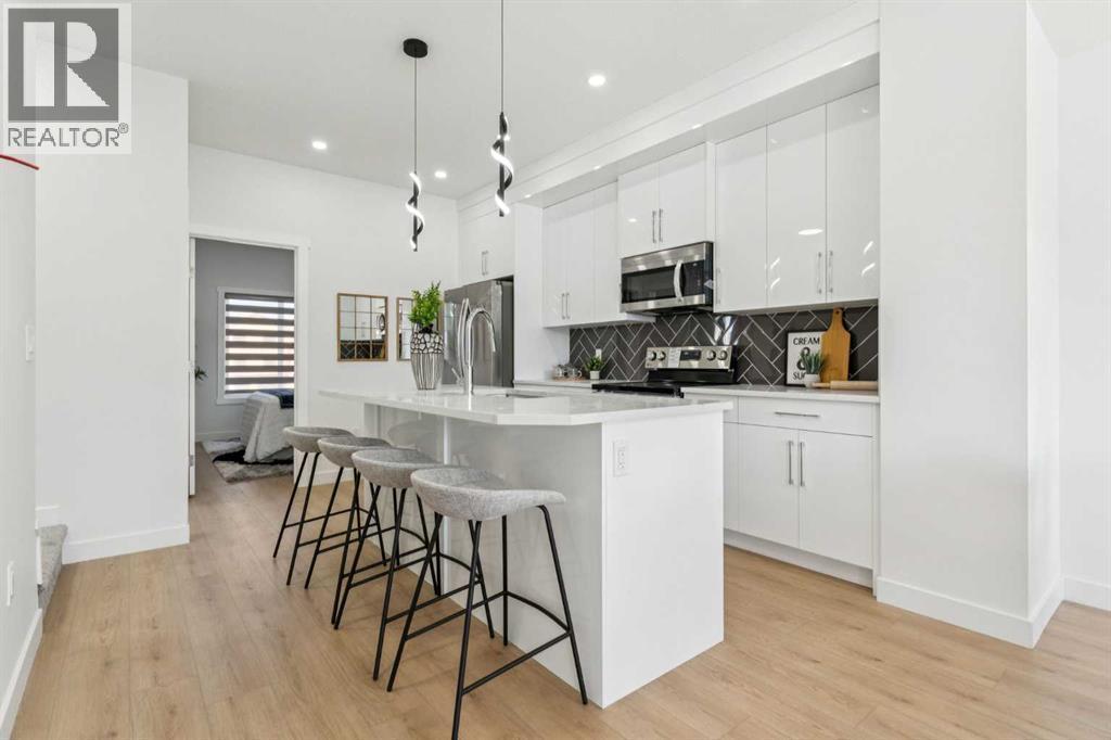 205, 95 Saddlecrest Circle Ne, Calgary, AB - Indoor Photo Showing Kitchen With Upgraded Kitchen