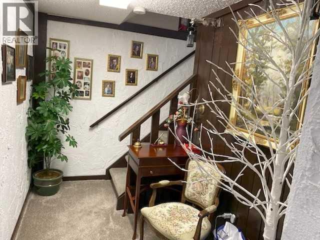 Stairs to lower level - 6311 Pineridge Road Ne, Calgary, AB - Indoor Photo Showing Other Room