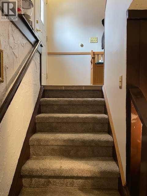 Stairs - 6311 Pineridge Road Ne, Calgary, AB - Indoor Photo Showing Other Room