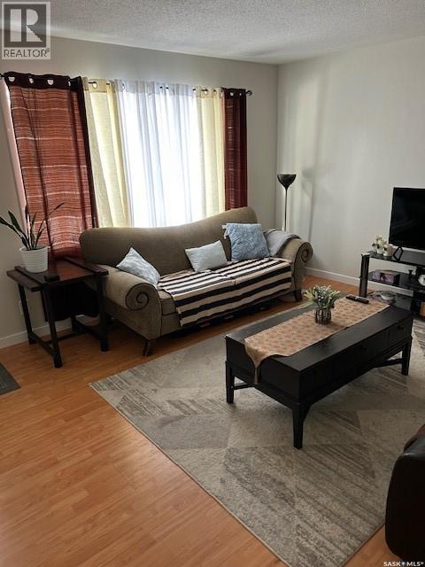 A And B 402 Ash Street E, Saskatoon, SK - Indoor Photo Showing Living Room